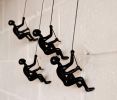 Set of Four Black Resin Climbing Man Hanging Dimensional Sculpture